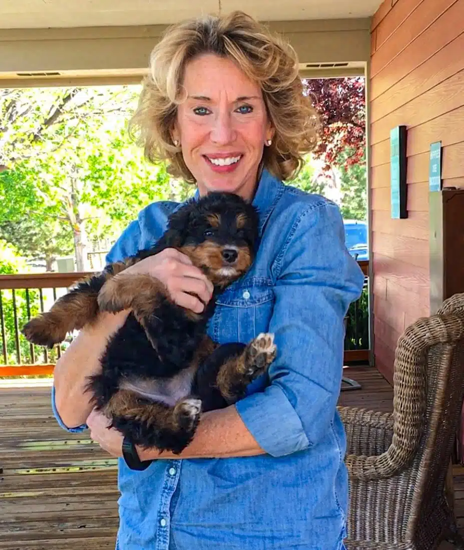 Lynn holding Izzy at her guardian home.