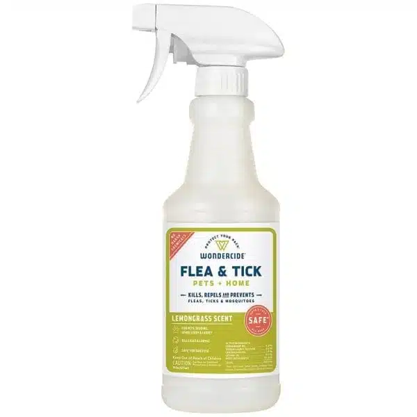 Flea & Tick Spray bottle over white background